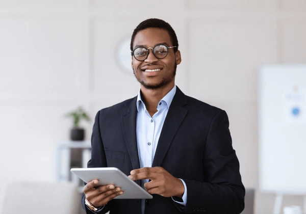 cheerful-young-black-man-manager-600nw-2510693647