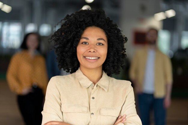 smiling-confident-african-american-young-woman-entrepreneur-looking-camera-posing-her-arms-folded_695242-4961